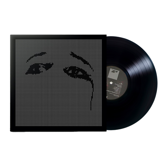Vinyl record album with a minimalist cover design featuring stylized eyes.