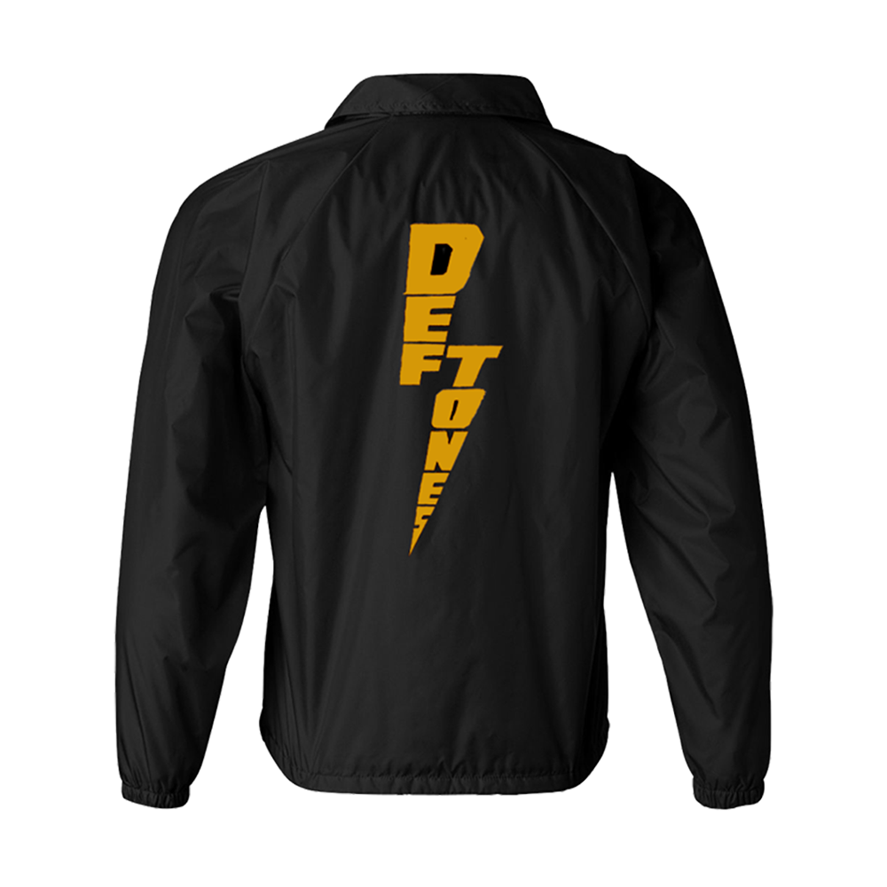Black jacket with a yellow lightning bolt design on the back containing the word ’DEFTONES’.