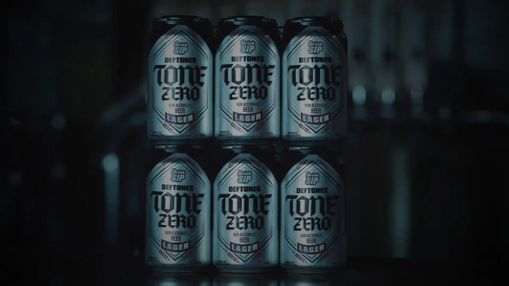 Six silver cans of Deftones Tone Zero non-alcoholic beer.